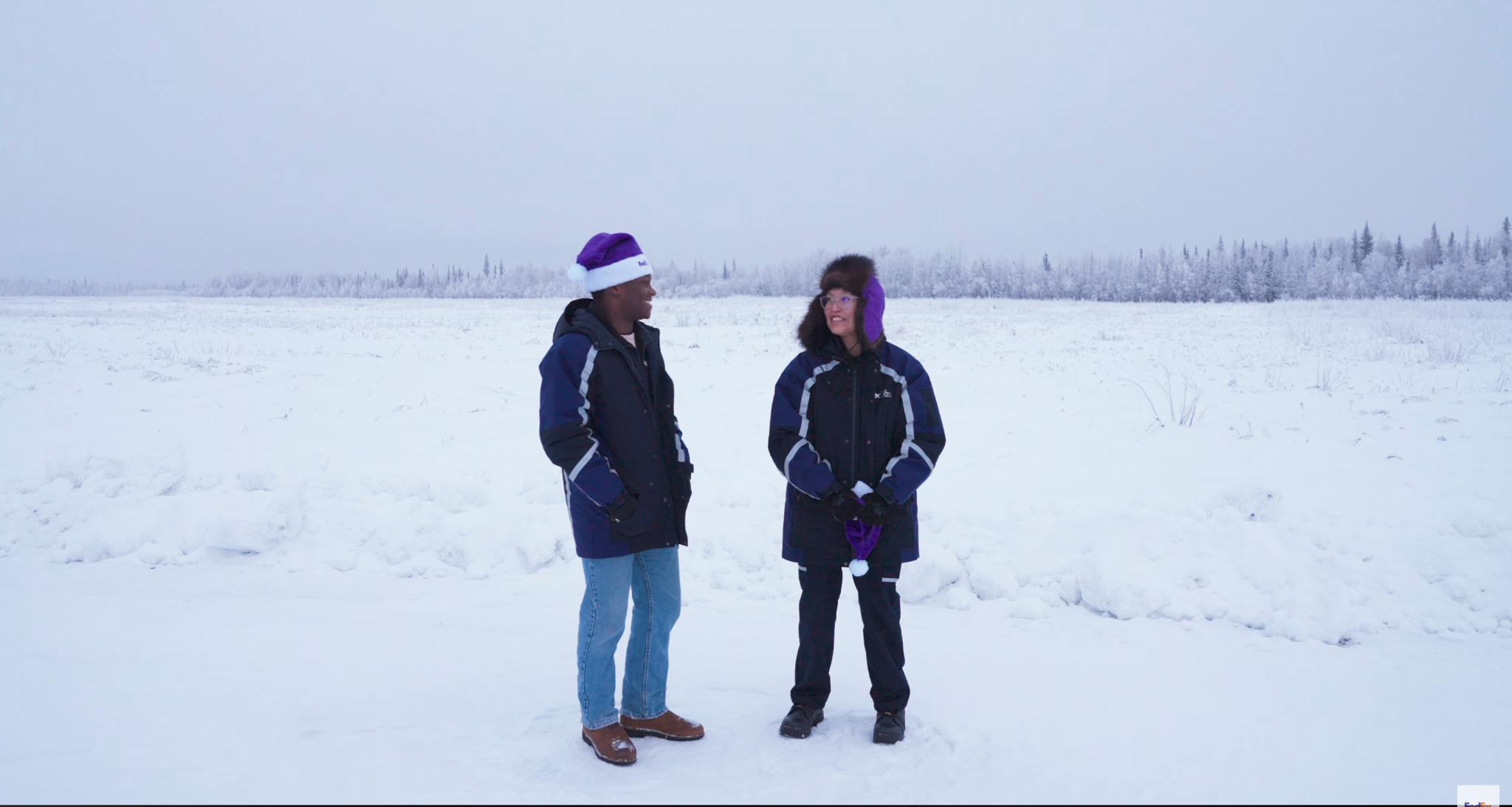 Titus Gardner and a FedEx courier standing together in rural Alaska