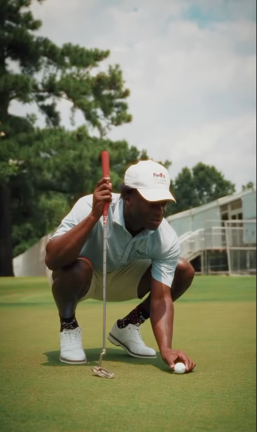 Titus Gardner lining up a putt at the FedEx St. Jude Championship